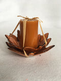 Harvest Candle Resting on Two Layered Leaves